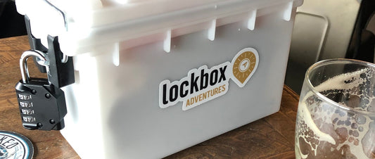 A locked box with various puzzles scattered around it, inviting players to solve the challenges and unlock the prizes inside